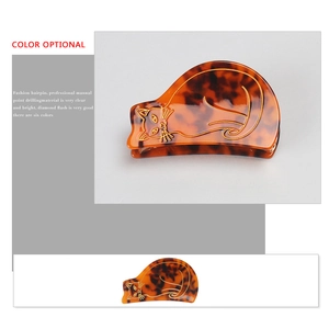 Pince à cheveux chat en acétate avec motif écaille de tortue brun et lignes dorées