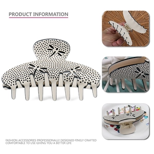 Elegant cream acetate shark hair claw clip with dragonfly cutouts and black polka dots
