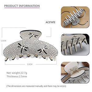 Polka dot acetate claw clip detail showing dimensions 9.0cm and 5.0cm with 22.7g weight
