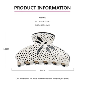 Acetate hair claw clip with black polka dots, 15.8g weight and 2.5mm thick detail