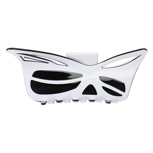 Detail view of large acetic acid butterfly hair claw clip with black and white pattern