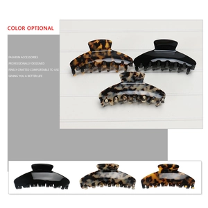 French vintage leopard print large shark hair claw clips in black and tortoiseshell