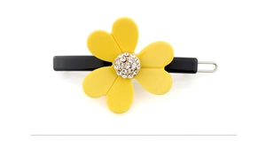 Detaillierte Nahaufnahme der gelben Blumen-Haarspange mit Strasssteinen und schwarzer Basis