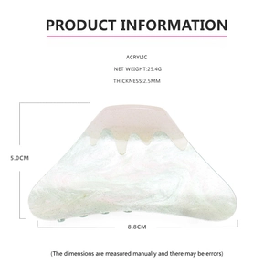Detailed view of mountain-shaped acrylic hair claw with snow-white and green flowy texture