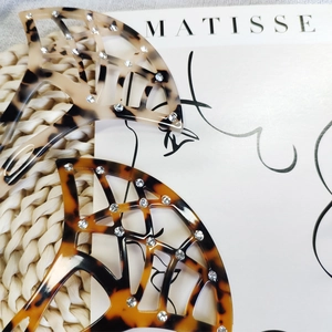 Detail showing shell pattern hair side comb with delicate hand-set white rhinestones