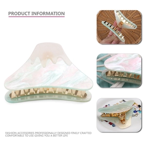 Mountain-shaped acrylic hair claw clip in mint green and cream white color fusion