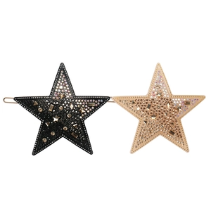 Barrettes à cheveux étoiles en acétate avec strass scintillants noirs et champagne
