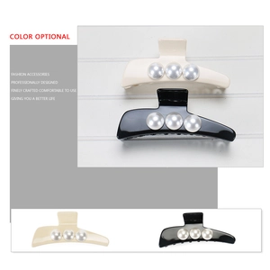 Close-up of premium acetate hair claw clip with elegant pearls and smooth resin finish