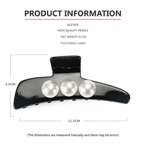 Detail view of acetate hair claw clip with pearls and size dimensions 11.5cm by 4.0cm