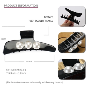 Detail view of large acetate shark hair clip with three high quality pearls and measurements