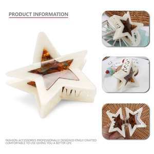 Star shaped acetate hair claw clip with cream base and tortoiseshell center for women