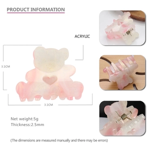 Mini acrylic bear claw clip with glitter finish and heart cutout design 3.1cm detail