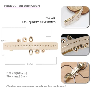 Barrette élégante en acétate beige avec strass champagne et clip à ressort métallique