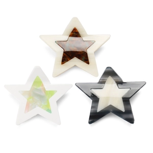 Three acetate star-shaped hair claws in ivory white and tortoiseshell on white background