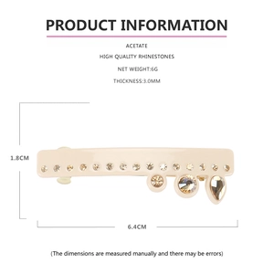 Détail de la barrette en acétate crème avec strass en forme de goutte et ressort
