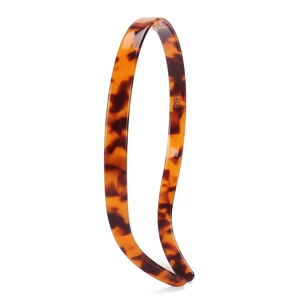 Detailed view of the slim acetate headband featuring retro leopard tortoiseshell texture