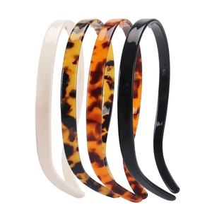 Set of four minimalist tortoise shell and leopard print acetate headbands in assorted colors