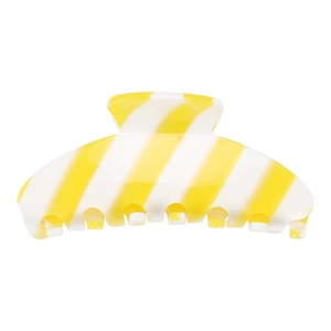 Macro detail of large acetate hair claw clip with yellow and white diagonal stripes