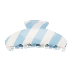 Macro shot of large acetate shark clip with blue and white diagonal stripes for hair