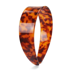 Detail shot of a 4cm wide tortoise shell headband with polished cellulose acetate texture