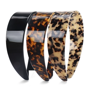 Three-piece set of wide acetate headbands in black, dark and light tortoiseshell patterns