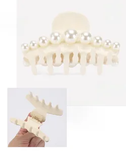 Detail view of 8.8cm acetate hair claw clip with gradient pearls and elastic spring