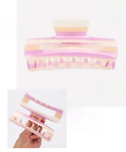 Detail of 14cm acetate hair claw clip showing purple marble texture and spring mechanism