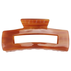 Macro detail of the amber rectangle acetate hair claw clip with marble texture