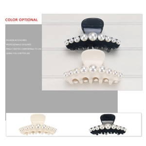 Classic large acetate hair claw clip with gradient pearl accents in black and cream beige