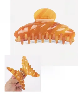 Amber acetate hair claw clip measuring 10.8x5.5cm with a lightweight 33.0g design