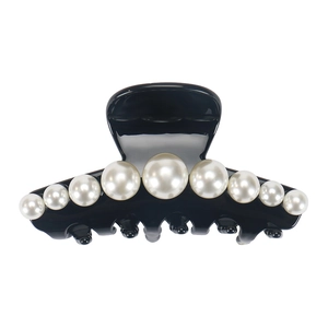 Close-up of black acetate hair claw clip featuring nine elegant white faux pearls