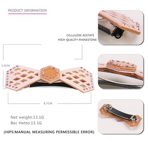 Detail of pink acetate bow barrette with rhinestones, sized 8.7cm x 3.4cm for women
