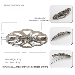 Detail view of acetate leaf hair clip with rhinestones showing dimensions 6.6cm by 3cm