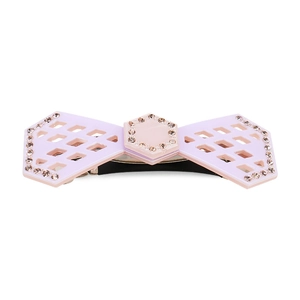 Detail of a bow-shaped spring hair clip featuring purple acrylic and sparkling rhinestones