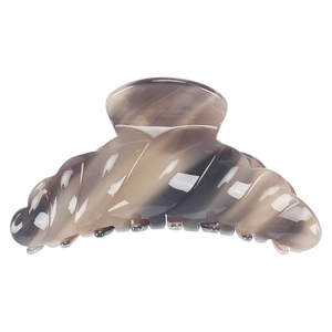 Close-up of marble pattern acetate hair claw clip with polished glossy finish
