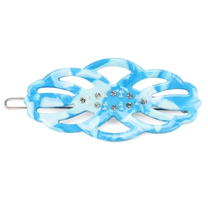 Macro detail of blue marble acetate hair clip with sparkling rhinestones and metal clip