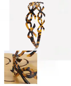 Detail view of acetate tortoise shell headband showing 11.5x13.5cm size and 15g weight