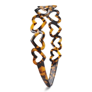 Chic tortoiseshell acetate headband with hollow heart patterns for women in amber brown