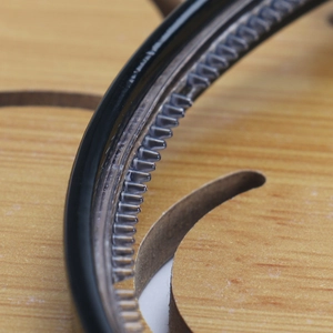 Macro detail of inner teeth design on black acetate headband for secure hair styling