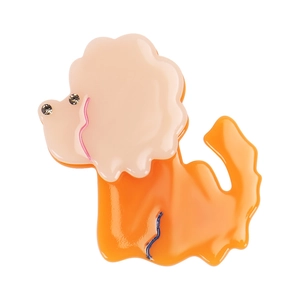 Vue détaillée d'une pince à cheveux caniche orange avec fausse fourrure rose et strass