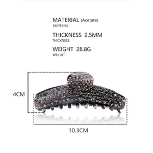 Detailed view of grey acetate hair claw clip with rhinestones and product measurements