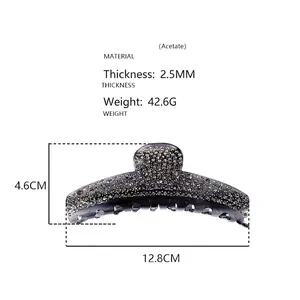 Detail view of a 12.8cm smoky gray acetate hair claw clip with rhinestones and size labels