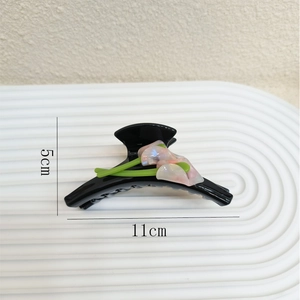 Elegant black acetate Calla Lily hair claw clip with pink floral detail, 11cm length