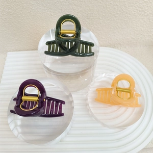 Lot de trois pinces à cheveux brillantes en vert foncé, violet et couleur ambre