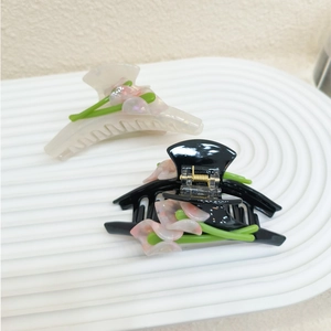 Elegant acetate calla lily hair claw clips in creamy white and polished black finish