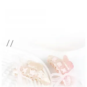 Detail view of pearlescent ribbon hair clips in cream and light pink with bow accents