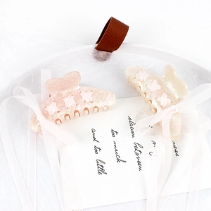 Pearlescent acrylic shark hair clips with long chiffon ribbons in pink and cream