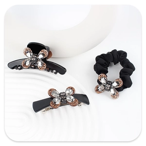 Ensemble d'accessoires de cheveux papillon noir avec strass sur socle blanc épuré