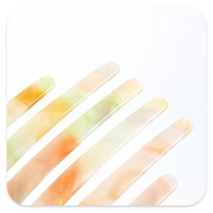 Close-up of premium marbled acetate hair claw clip with smooth green and orange teeth