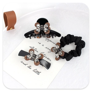 Détails de l'ensemble de trois accessoires cheveux noirs avec strass papillon